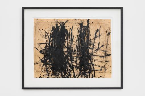 The photo shows an abstract painting, untitled: wild black brushstrokes on beige paper