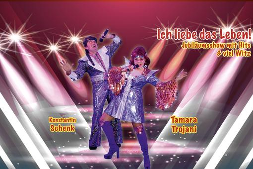 The poster for the show with the two artists in glittering purple costumes in the style of the 1970s