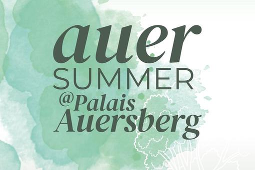 The photo shows the lettering auer summer@Palais Auersperg in dark gray against a turquoise-white background blurred like watercolors
